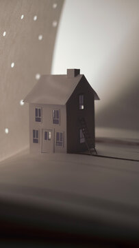 Paper Skies, a paper craft home sits under a paper sky