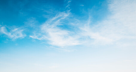 Obraz na płótnie Canvas white clouds with blue sky background
