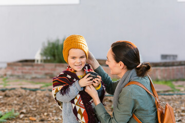 Mom and little son outside in fall time
