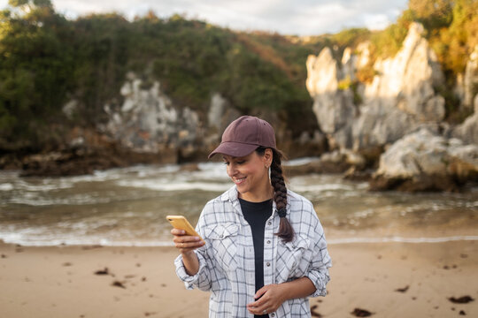 traveler woman with mobile phone in nature