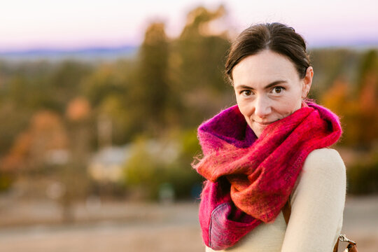 Woman wearing wool scarf outdoor in fall