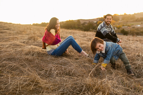 Funny family enjoying together outside
