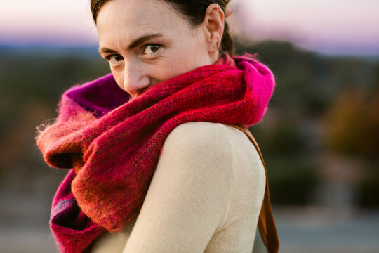 Crop woman with fuschia scarf outdoor portrait