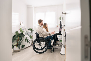Disabled man in Wheelchair Working from Home