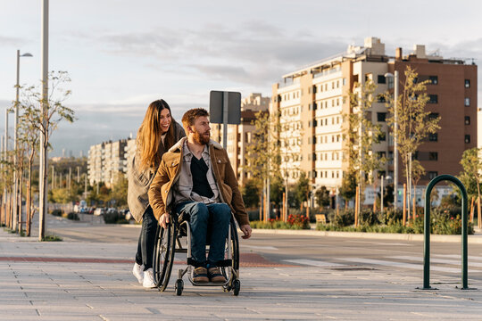 Happy Woman Helping his Handicap Boyfriend