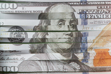 Shredded 100 dollar bill, close up.