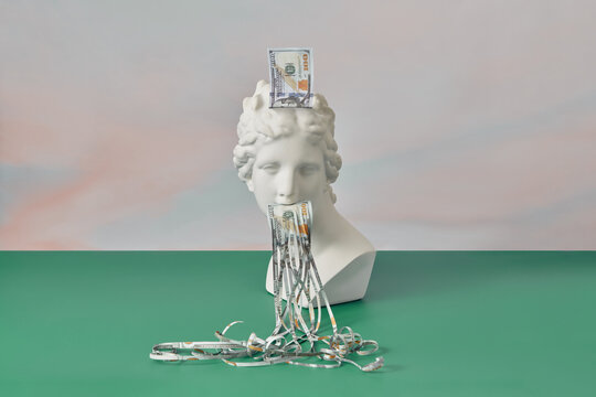 Extended dollar banknote strips and Aphrodite.