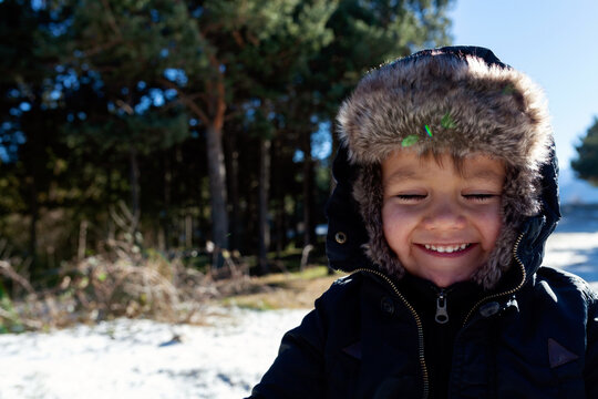 smiling little kid during winter time 