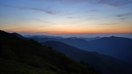 Fototapeta premium View of the surrounding mountains from the Hadong gliding field in South Korea