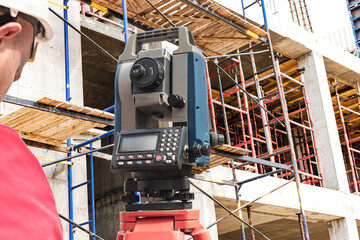 Surveyor equipment. Surveyor telescope at construction site or Surveying for making contour plans is a graphical representation of the lay of the land startup construction work.