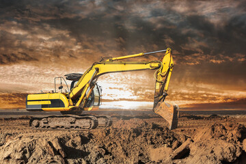 A large yellow excavator moving stone or soil in a quarry. Heavy construction hydraulic equipment....