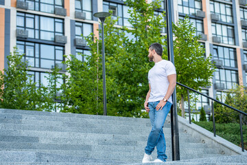 caucasian man in jeans outdoor. caucasian man in the street. caucasian man outside.