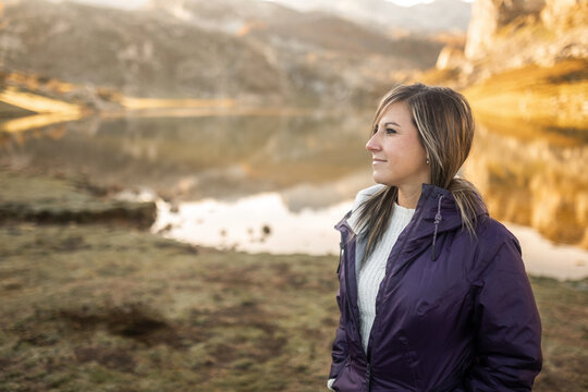 Young Woman In Coat In Nature