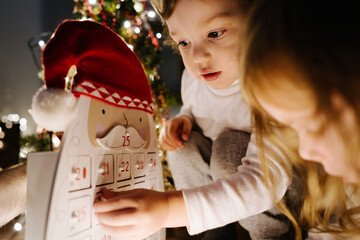 Children with Christmas advent calendar