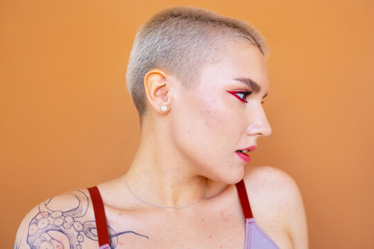 Young androgynous model with short blond hair 