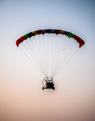 paraglider silhouette on sky
