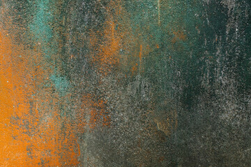 Painted in green and orange old concrete wall texture 