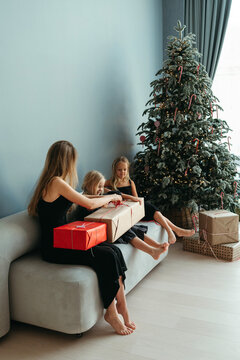 Family gives each other Christmas presents.