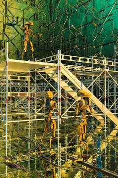 Robots building scaffold tower
