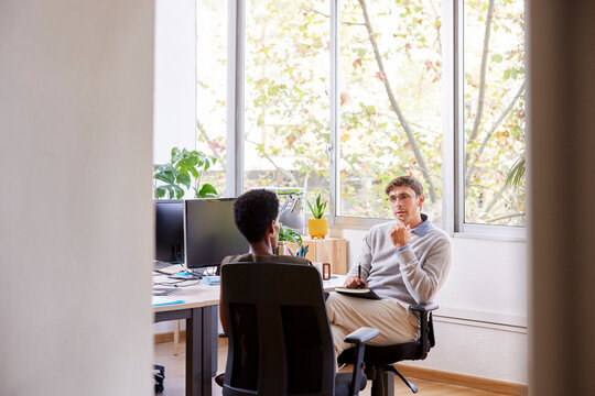 Male Manager Interviewing Black Female Employee