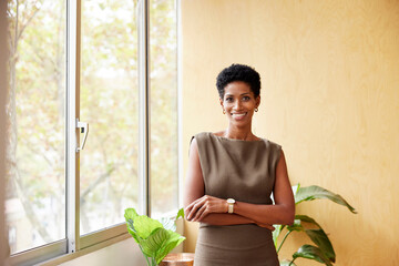 Smiling elegant black business lady in office
