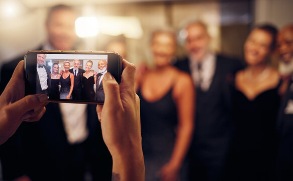 Phone photography, hands or people in a party to celebrate goals or new year at luxury event. Women, screen or group of friends smile in pictures for social media at fun dinner gala or happy birthday