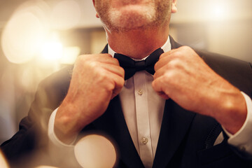 Hands, fix bowtie and tuxedo for party, event or celebration gala in night for formal fashion....