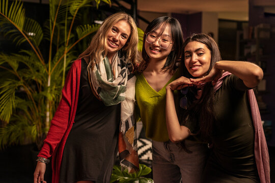 Multiracial women at party