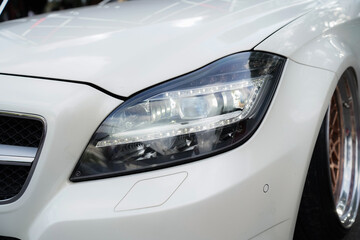 Fototapeta na wymiar headlight of modern prestigious car closeup