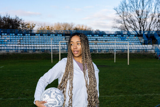 Portrait of a woman with a soccer ball