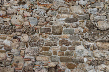 Background of brown-gray stone wall  . Pattern of slate wall texture and background