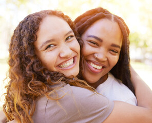 Obraz premium Young women and friends hug portrait for togetherness at park for bonding, wellness and happiness. Gen z, youth and natural black people with happy smile and embrace on summer hangout in nature.