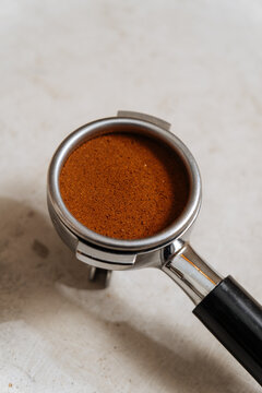 Espresso machine portafilter filled with coffee
