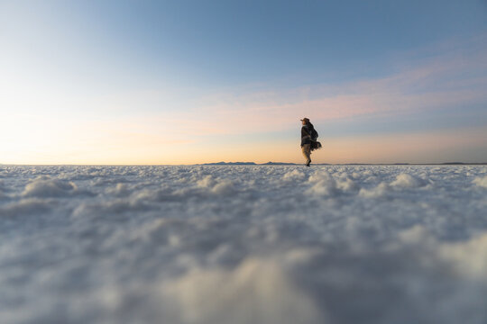 Woman walking alone in the world's largest salt flat