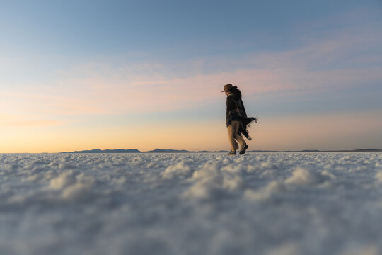 Woman walking alone in the world's largest salt flat
