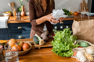 woman's hands with fresh parsley in the kitchen