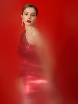 Fashionable model on a red background with a blur effect