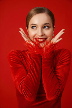Portrait of a beautiful smiling woman in red