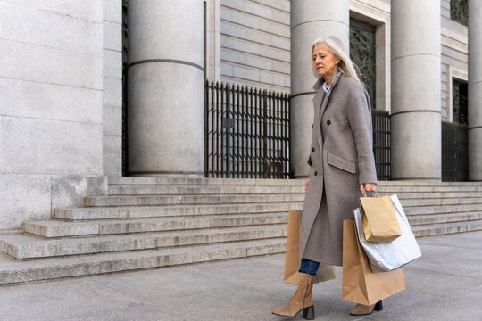 Stylish Woman With Shopping Paper Bags.