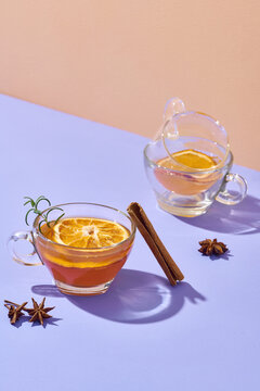 Transparent glass cup with hot red fruit tea