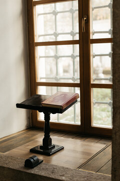 red book on a wooden stand