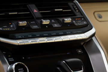 Car media buttons dashboard. Detail of a modern car controllers.