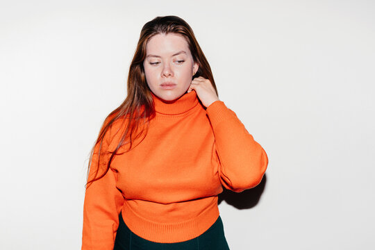 Woman in orange sweater