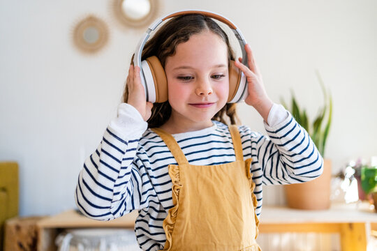 Pretty girl with headphones indoor portrait