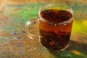 Still life - tea time. Mug of hot drink on a bright background - top view