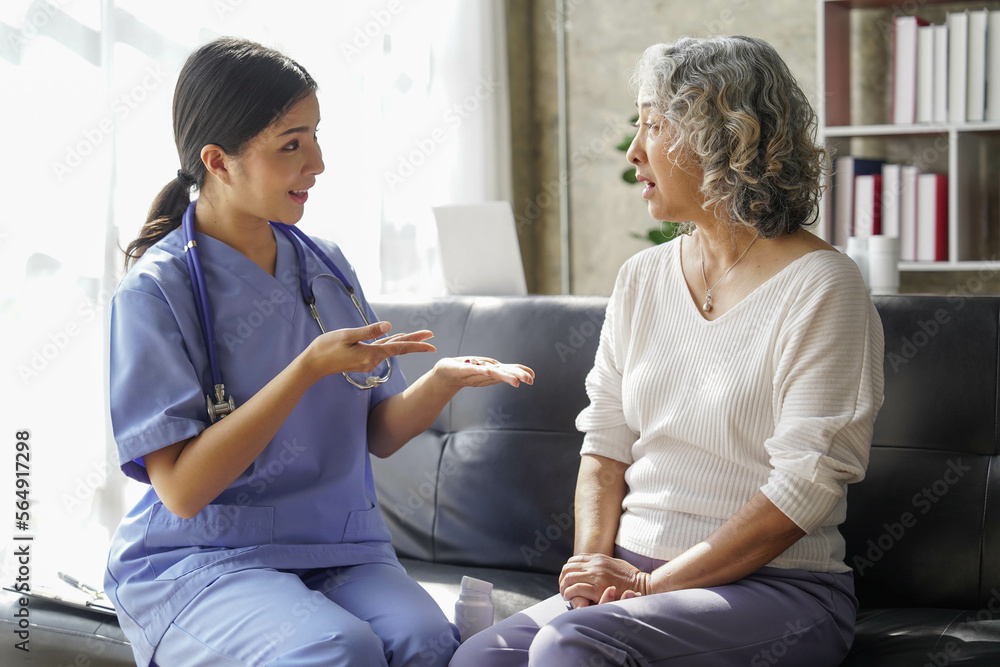 Wall mural  consulting female patient about pills and discussing health treatment sitting in the office at the desk. Medicine and health care concept. Doctor prescribing medicine to patient in the office.