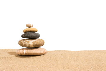 Fototapeta na wymiar Stack of stones on sand. Relaxing on the beach. Stability concept