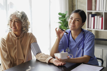  consulting female patient about pills and discussing health treatment sitting in the office at the desk. Medicine and health care concept. Doctor prescribing medicine to patient in the office.