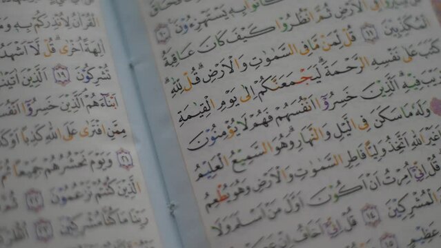 Close up of an opened Quran page, holy book of islam religion