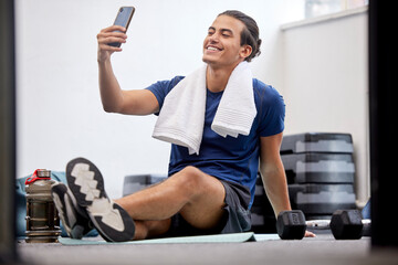 Fitness, happy man and selfie for social media or profile picture with towel after workout exercise or training at gym. Sporty male vlogger or influencer with smile in happiness for online vlog post